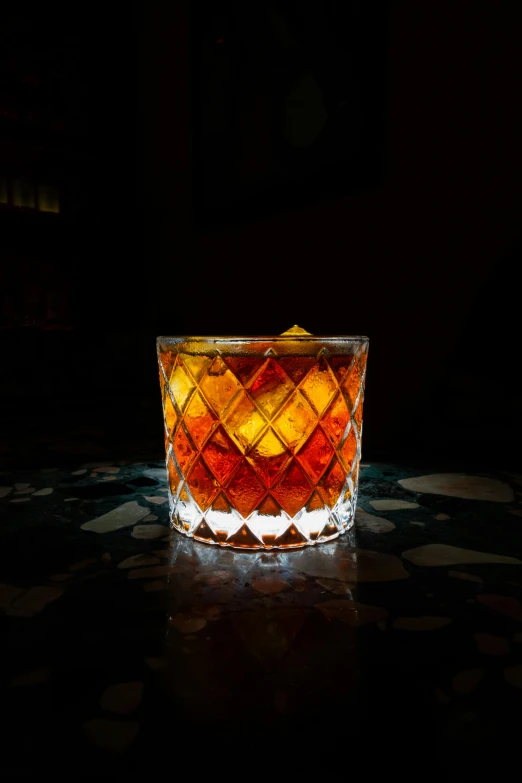 an interesting glass with a light reflecting in it