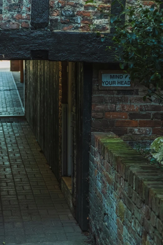 an archway on top of a brick building