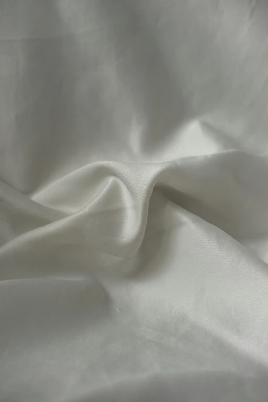 white cloth made up in soft folds on top of it