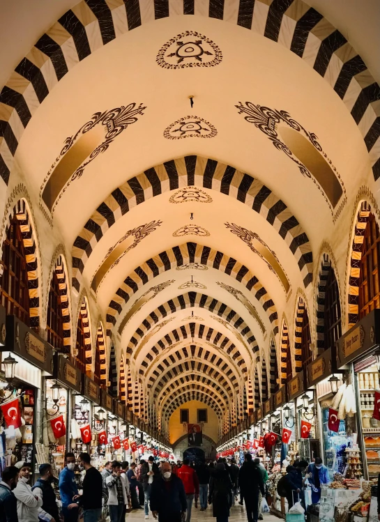 many people are walking around the shopping mall