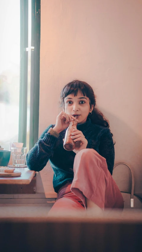 a woman that is sitting down in front of a mirror