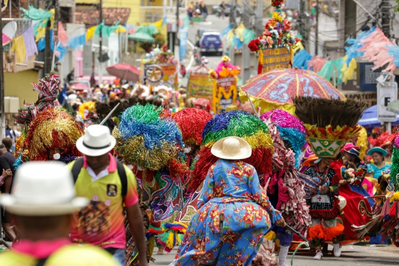 many people walking down a street decorated with decorations