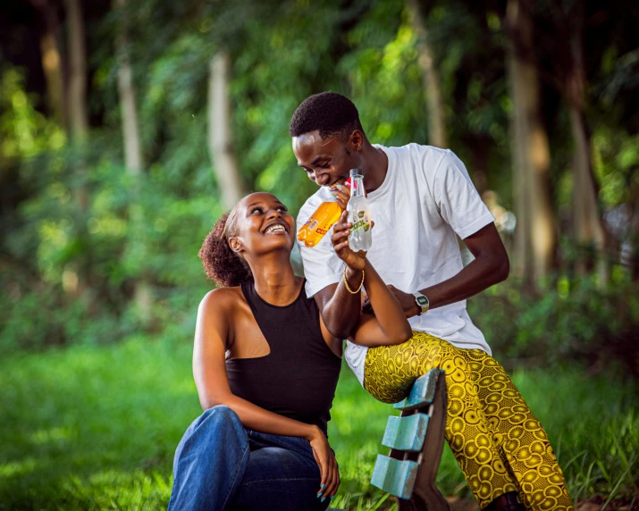 an image of a couple eating in the woods