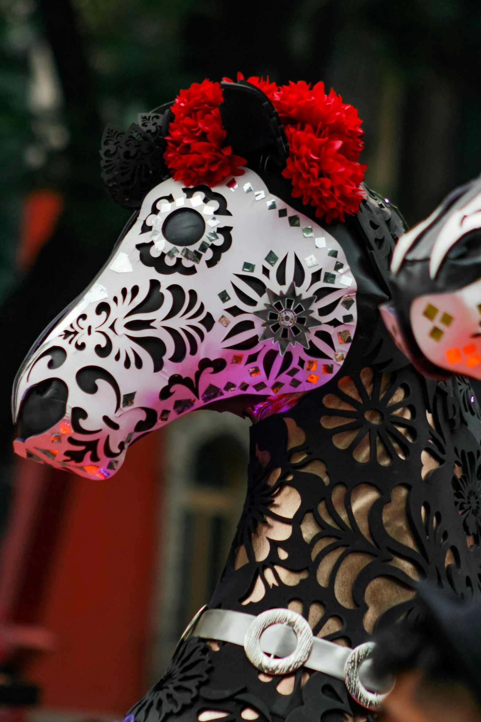 a horse wearing a white and black sugar skull