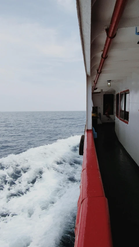 the view of a boat traveling across a body of water