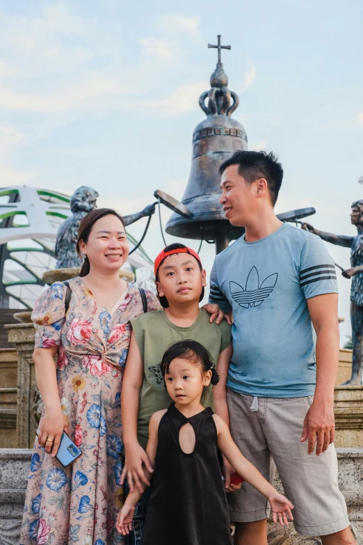 a family poses for a po in front of the water fountain