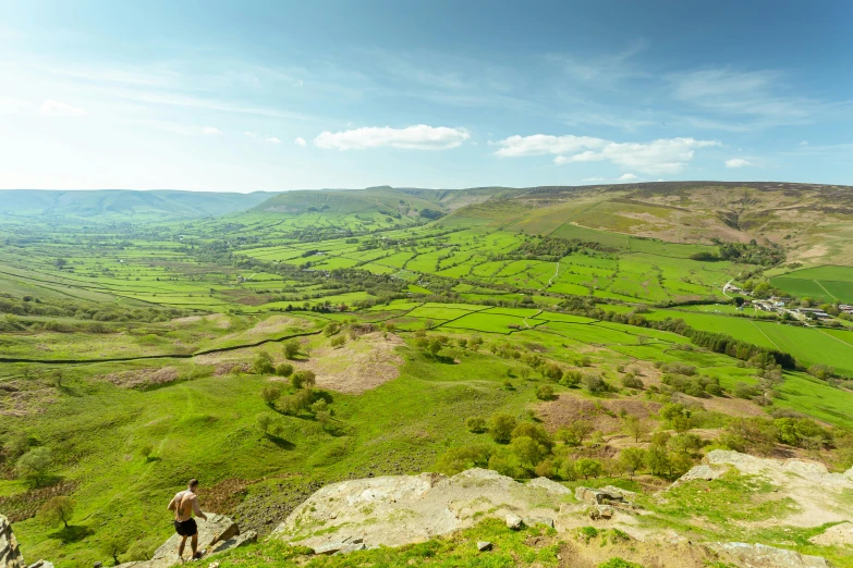 a man standing on top of a cliff