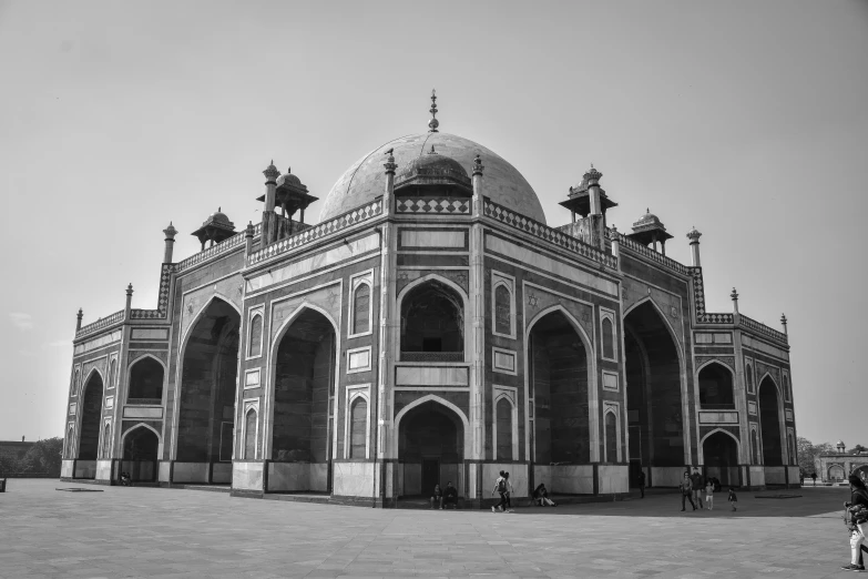 a large dome is in the middle of an empty square