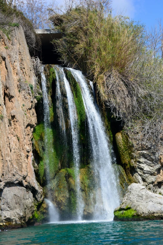 a long waterfall with water running from it