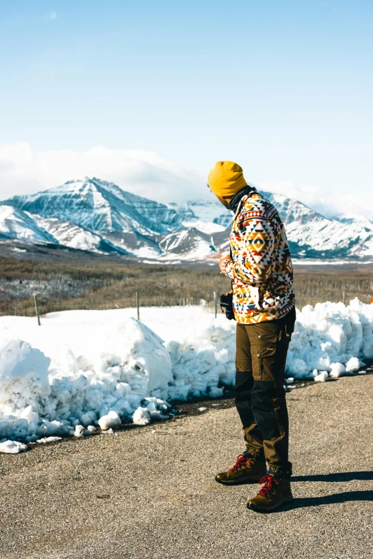 the person is standing in front of some snow