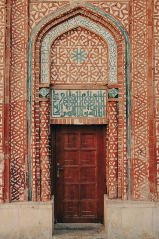 two doors with an elaborate design painted on it