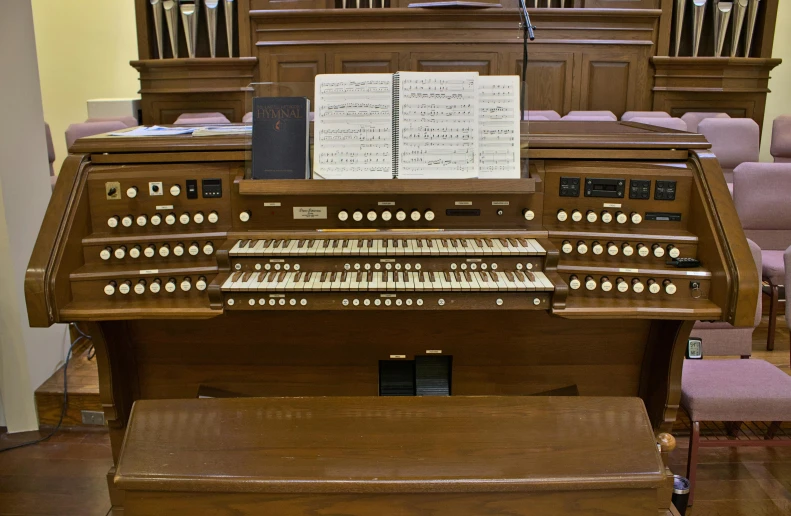 an organ has sheet music attached to it