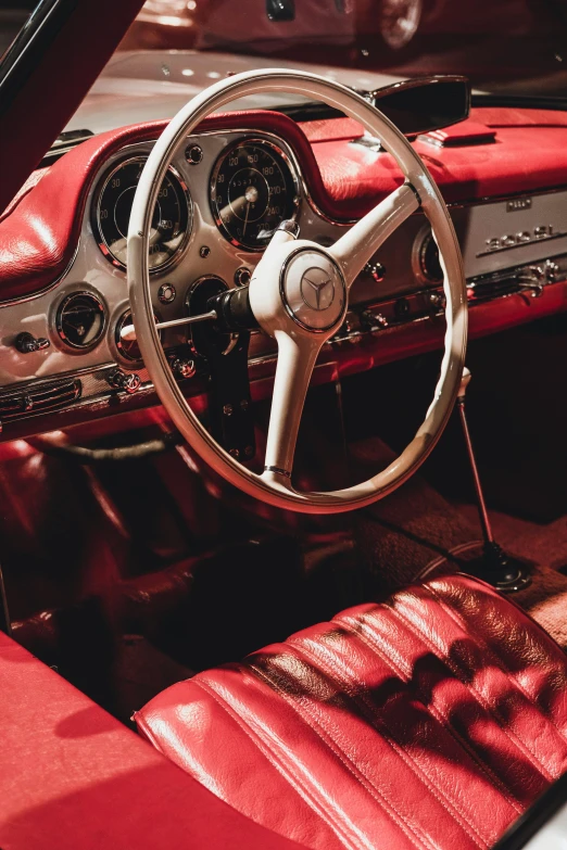 the interior of a car with red seats