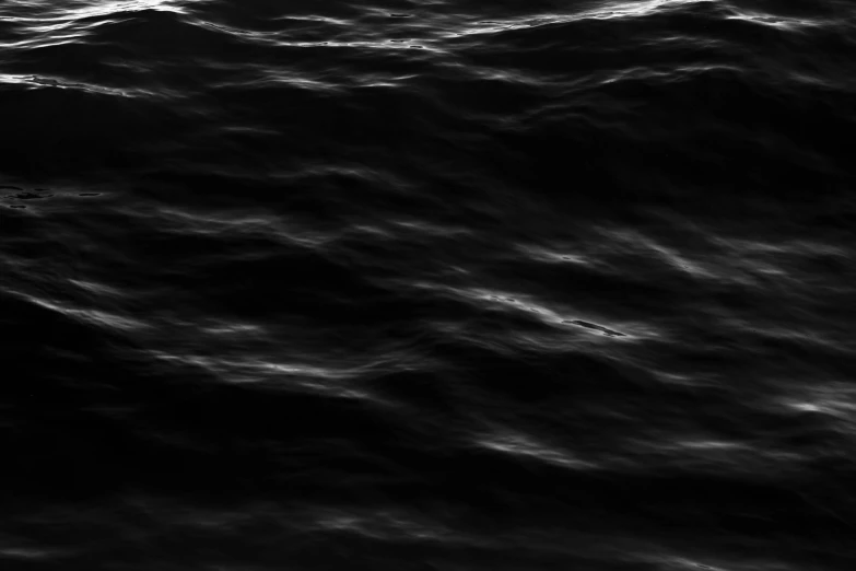 a boat on dark water with light coming in