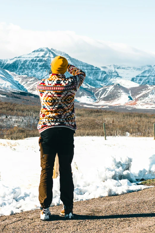 a person is standing at the top of a snowy hill