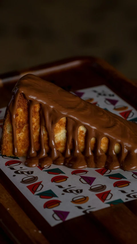 a chocolate pastry on a colorful tray with other items