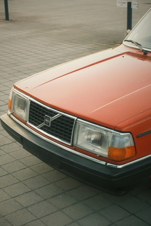 the front view of an orange car is shown