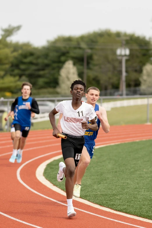 two boys racing down a track in a race