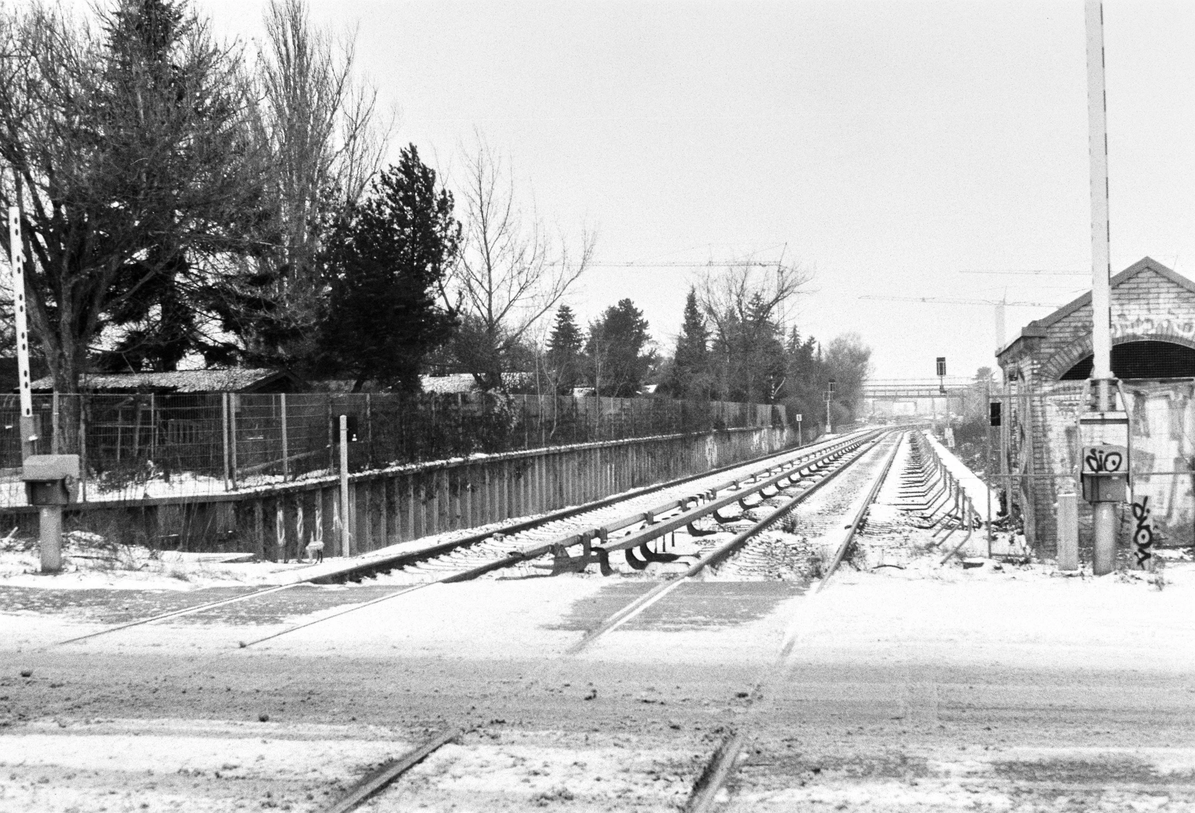 black and white pograph of empty train tracks