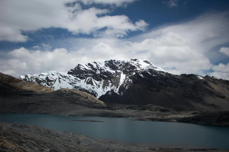 some mountain are covered with snow in the middle