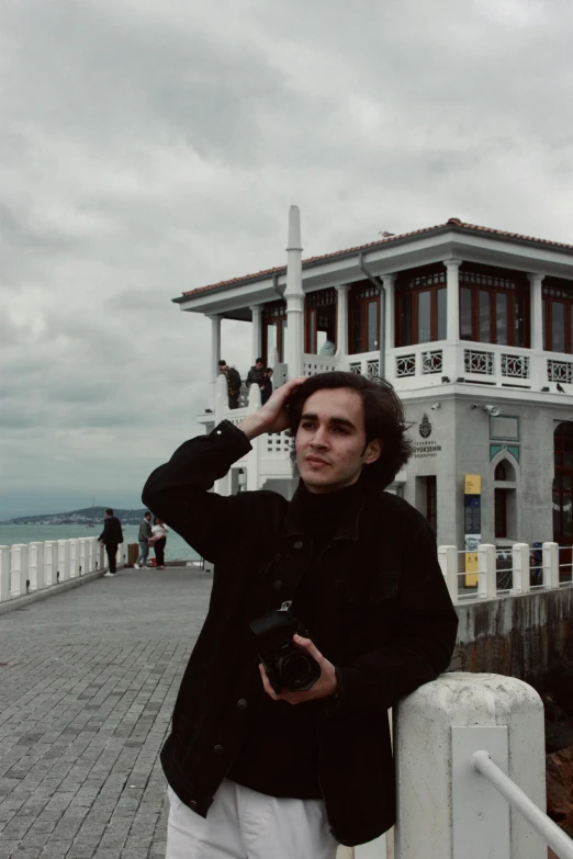 the person is taking pictures on a pier