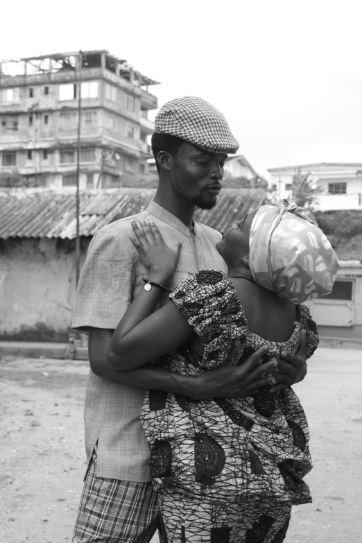 the man and the child are walking down the street