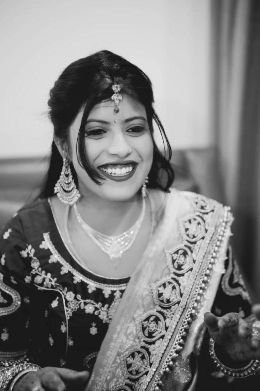 black and white po of woman laughing with a smile