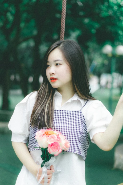 an image of an asian woman that is holding flowers