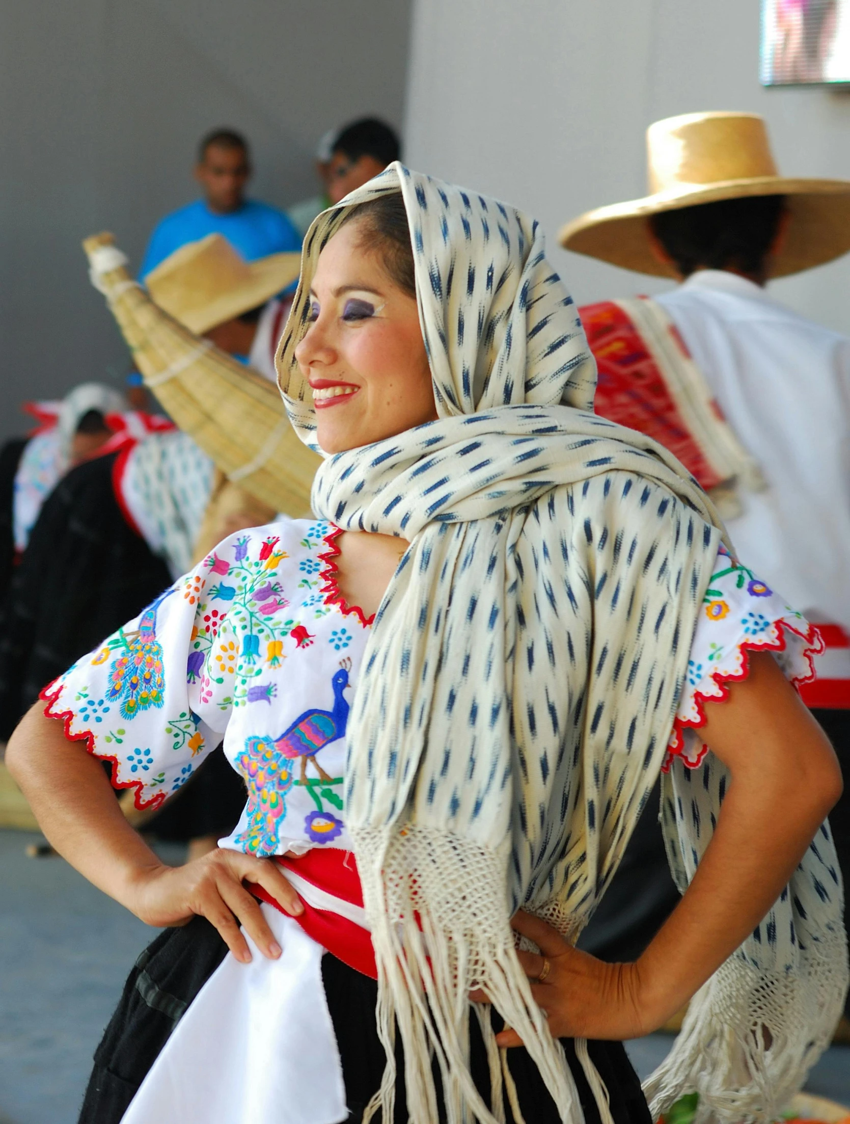 a woman with a dress and head covering is smiling at the camera