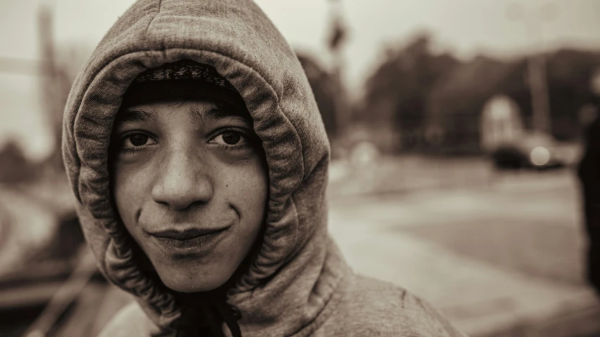a child in a hoodie on a street