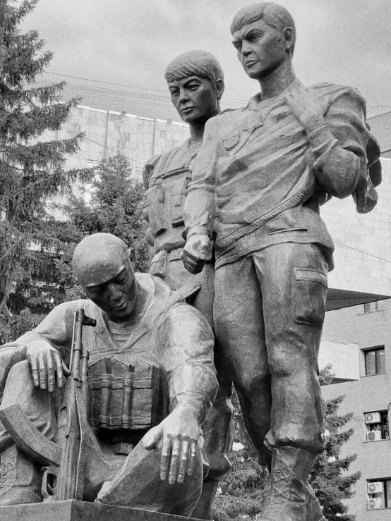 a couple of people that are near a statue