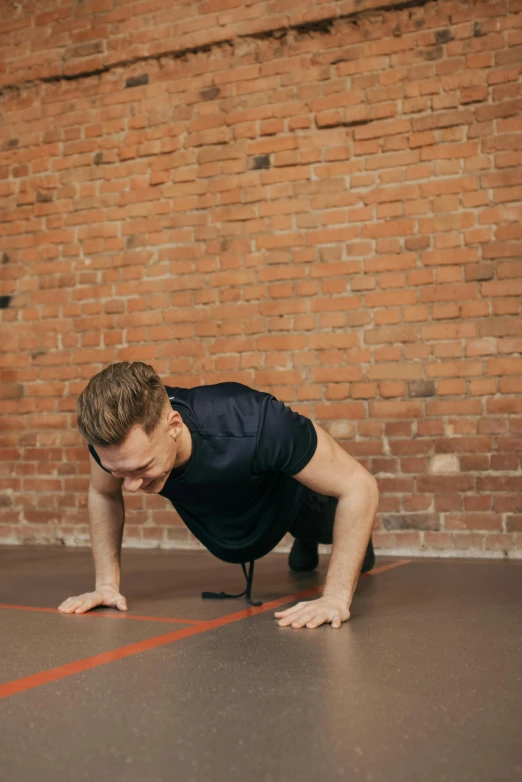 a man stretching while doing a backbend position