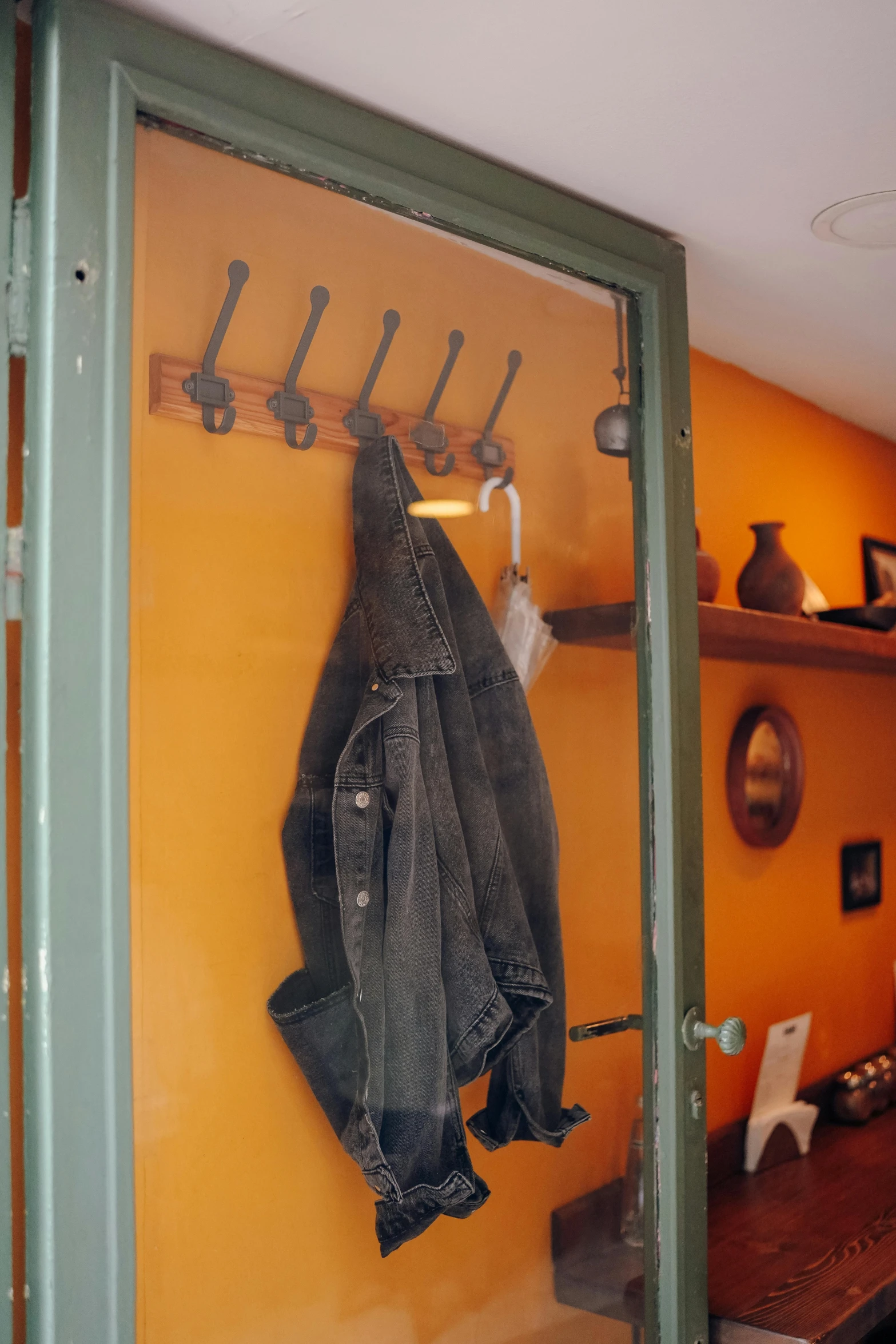 a coat rack that has been placed on the wall