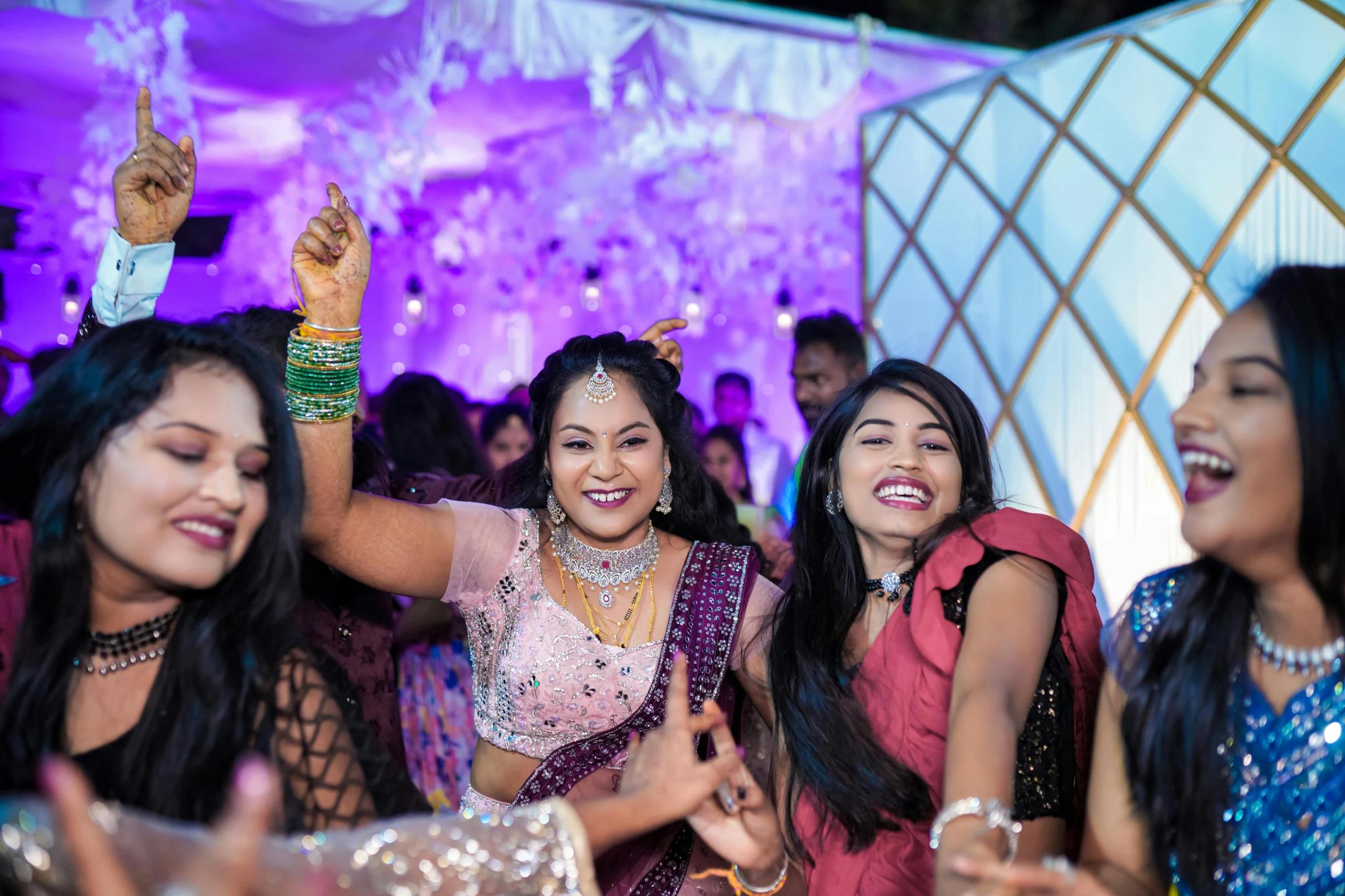 four women are posing for a po at the wedding