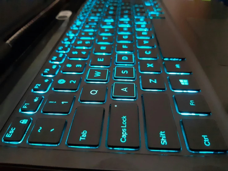 a close - up of the illuminated keys of a laptop