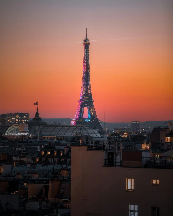 a tall tower in the middle of a city at night