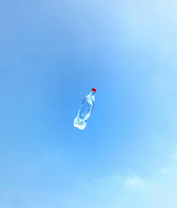 a bottle is flying up into the air