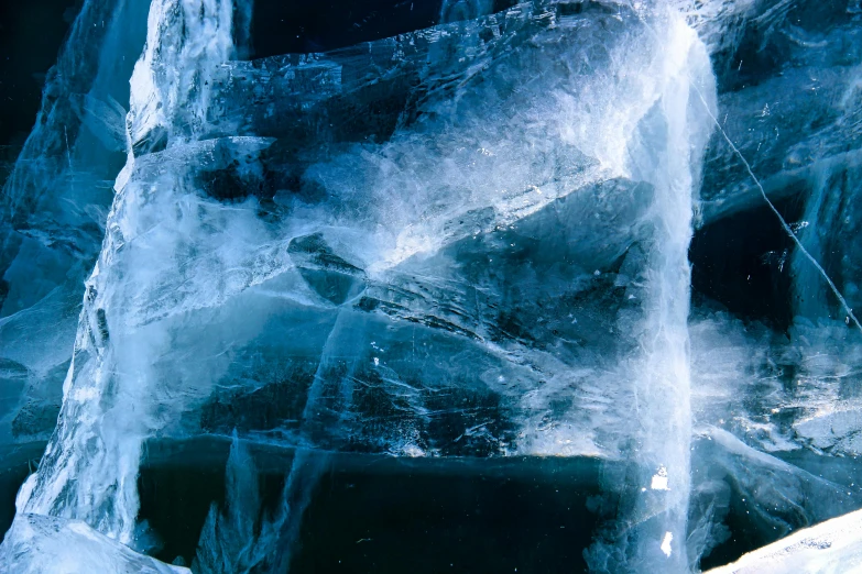 two pieces of ice are shown next to a wall