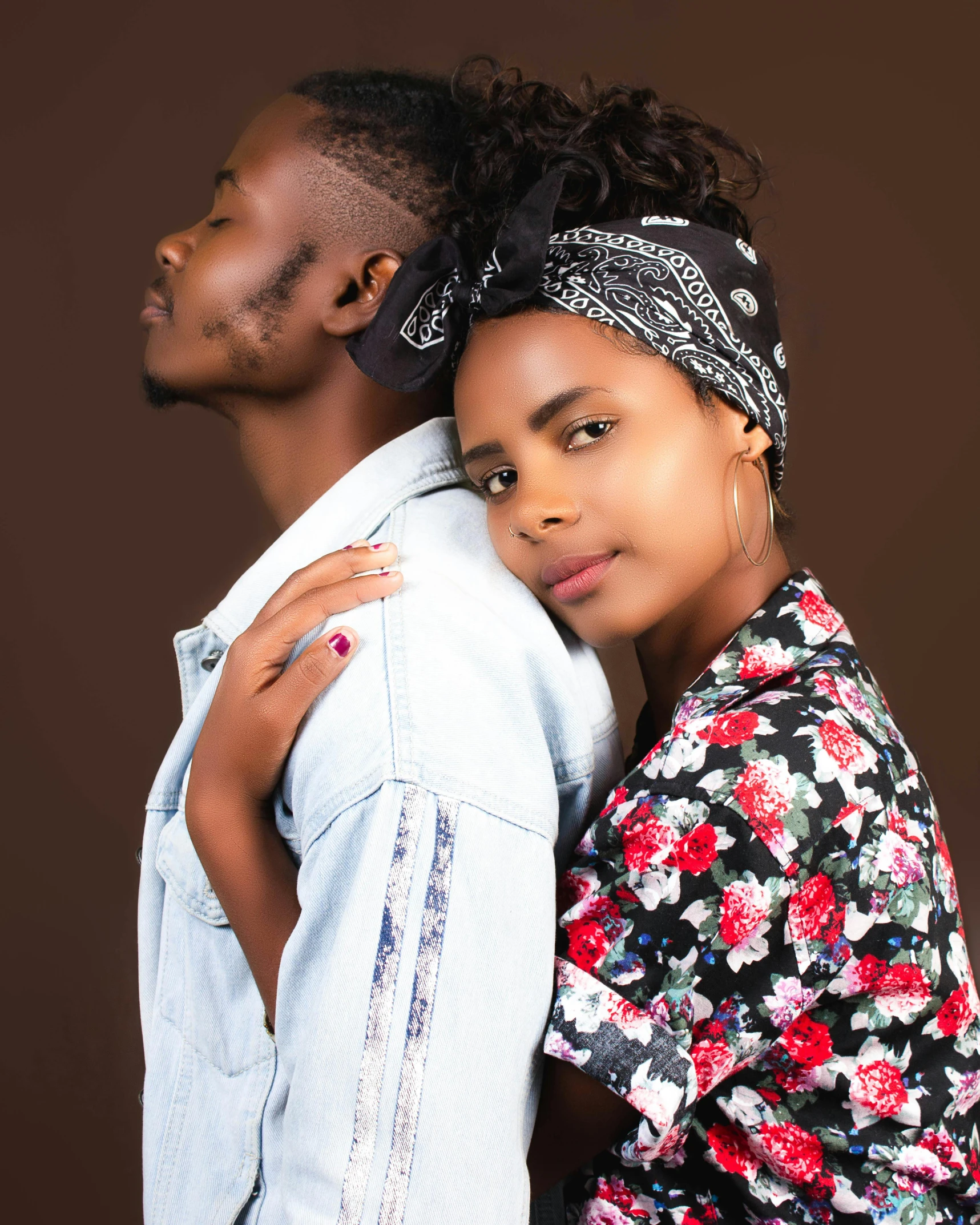 young couple in love in the studio posing for camera