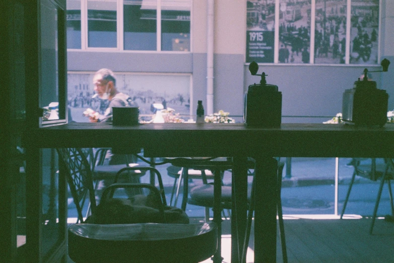 a person sitting at a table with some items in front of them