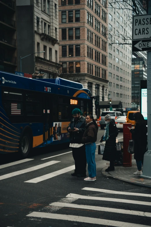 a bus on the street is stopped at the crosswalk