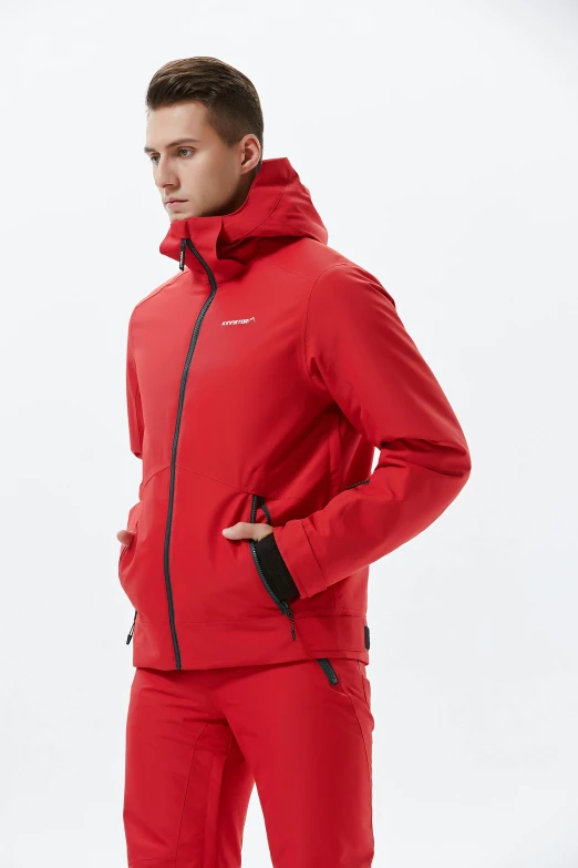 man in red sporty jacket standing and looking at camera