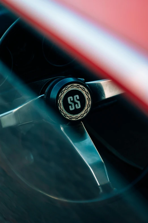 a close up of the rear wheel of a red and black vehicle