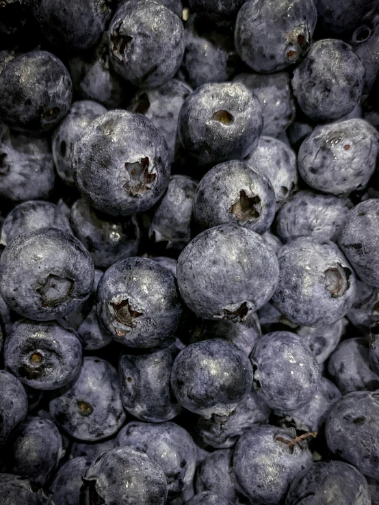 blueberries are piled on top of each other