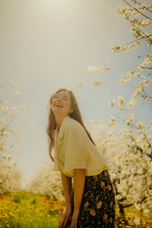 a girl is smiling and posing for the camera