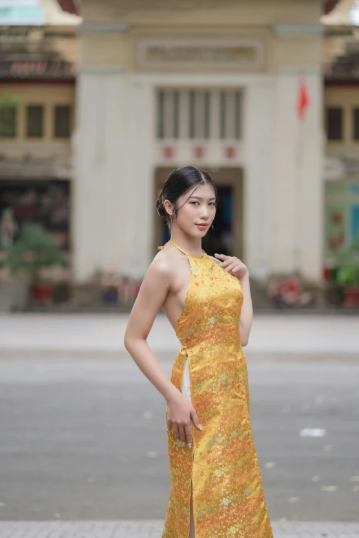 a beautiful woman standing on top of a brick road