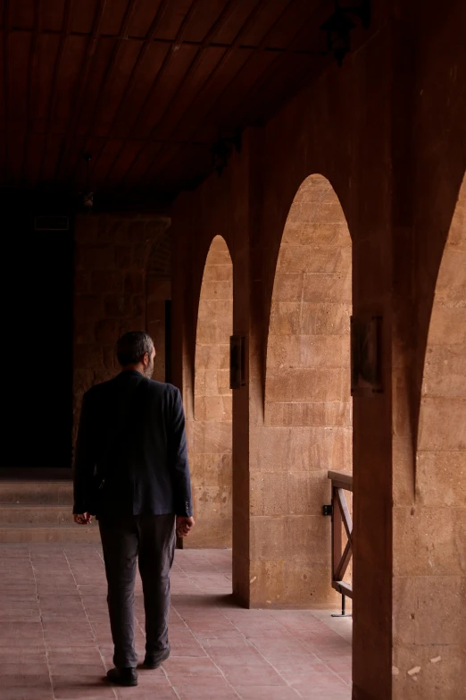 a man is walking around in a public place