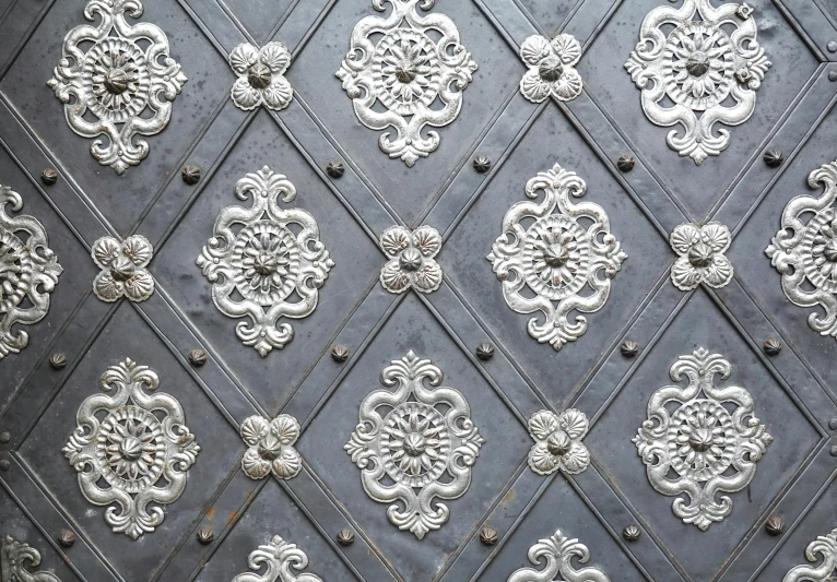 an array of white designs on the wall