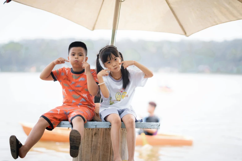 a couple of s sitting on a wooden post