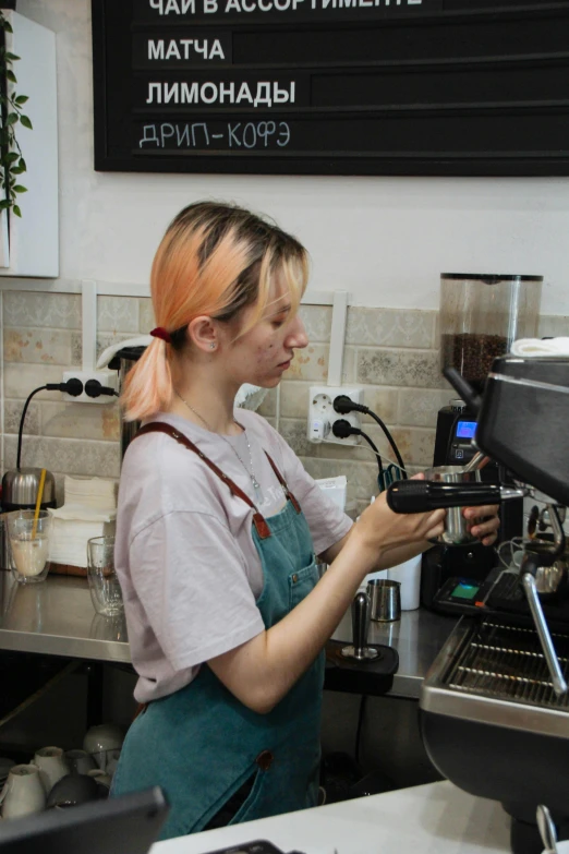 a bari working behind the counter at a coffee shop